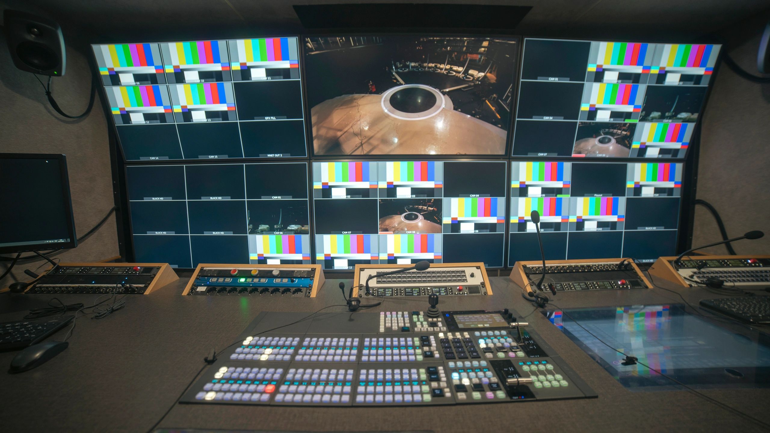 Professional broadcast control room with video switcher and multiview monitors