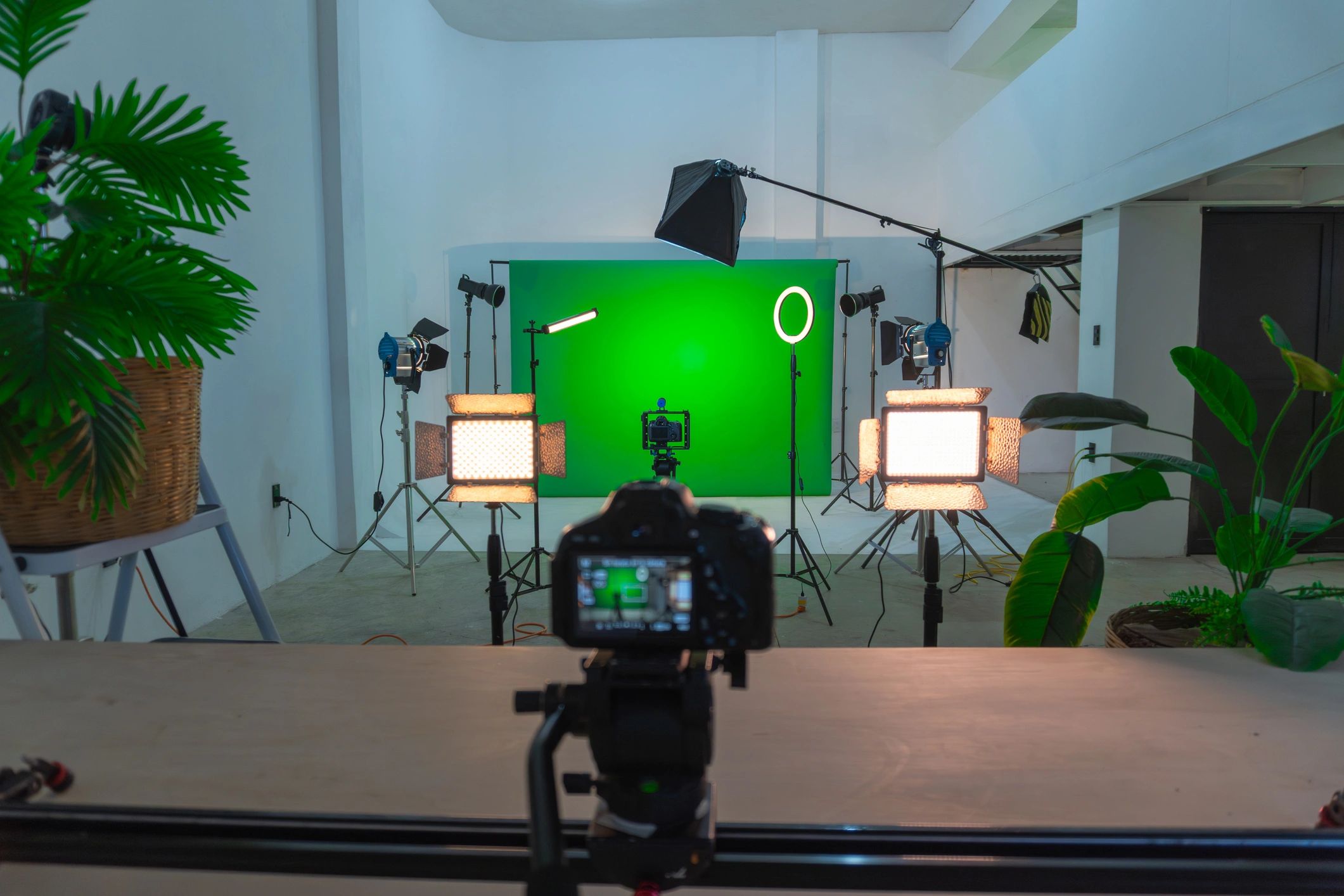 Studio setup with green screen and professional production lighting
